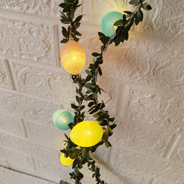 Battery-powered Easter decorative lights with glowing cracked eggs and leafy garland, bringing a festive and inviting atmosphere to any setting.