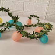 Elegant Easter rattan string lights featuring pastel egg bulbs, adding warmth and charm to any room, party, or outdoor space.