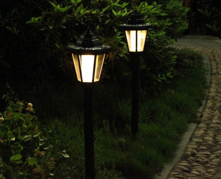 Fence-mounted solar light glowing at night, perfect for garden and pathway illumination.





Elegant hexagonal solar wall light illuminating a backyard fence at dusk.




