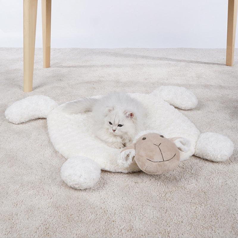 Fluffy grey and white cat lying peacefully on a cuddly lamb-shaped pet mat, ideal for naps.

