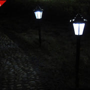 Outdoor LED wall lamp installed on a house exterior, enhancing security and aesthetics.

